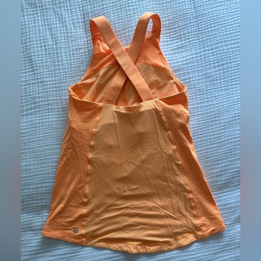 Lululemon tangerine cross cross back with adjustable bra.